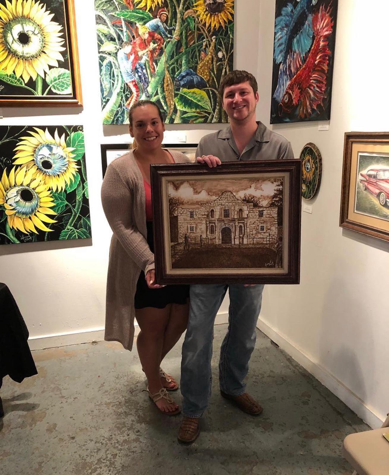 Collectors with The Alamo painting