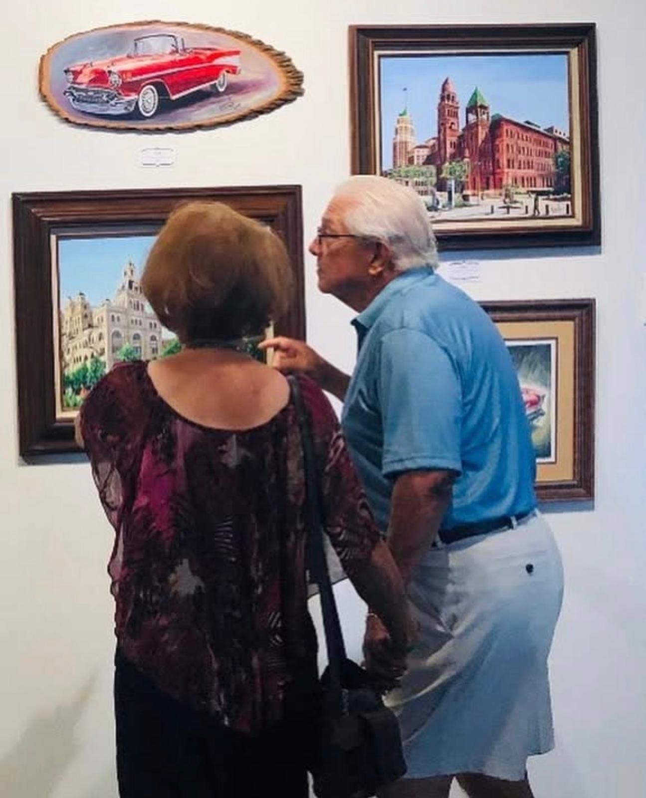 Collectors at the exhibition viewing Yosan's San Antonio works